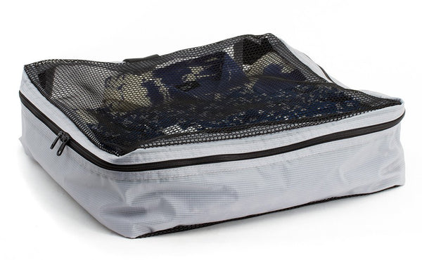 A filled and zipped closed Northwest Sky (light grey) Aether Large Aeronaut 45 Packing Cube.